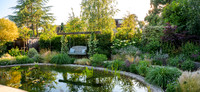 Finchley garden with a pond by Acacia Gardens designed by owner